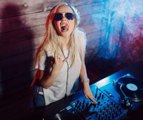 Grimacing DJ girl Stock Photo