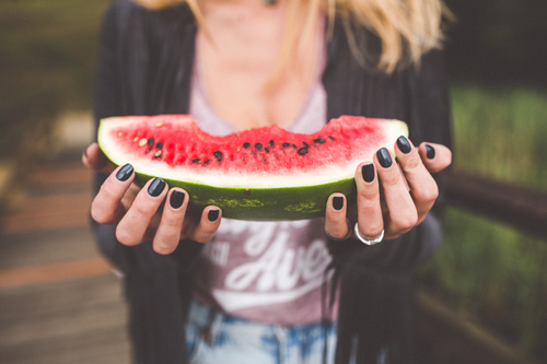 Hands holding watermelon Stock Photo