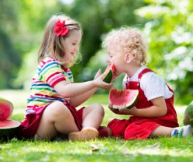 Joyful children are eating a watermelon Stock Photo (2)