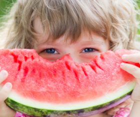 Joyful children are eating a watermelon Stock Photo (7)