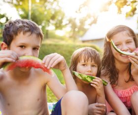Kids eating watermelon Stock Photo