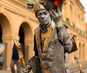 Male street artist in ancient costume Stock Photo