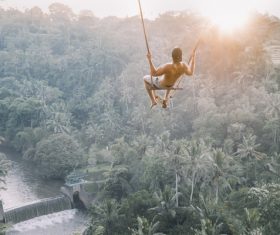 Man is swinging Stock Photo