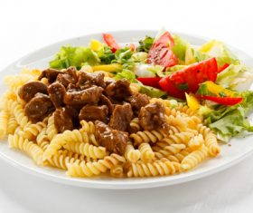 Mushroom spaghetti with salad Stock Photo