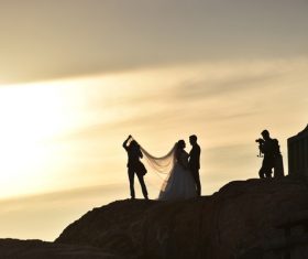 People taking wedding photo at dusk landscape Stock Photo