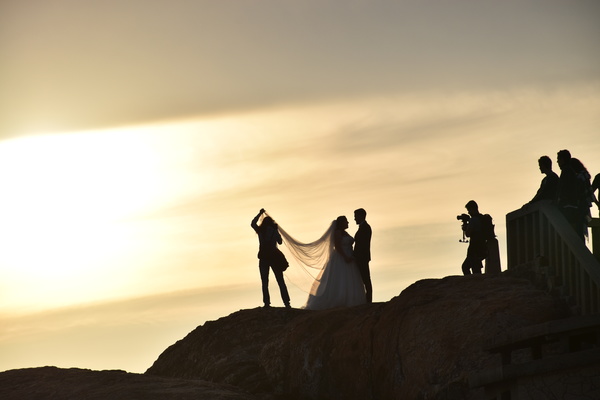 People taking wedding photo at dusk landscape Stock Photo