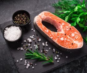 Salmon and spices on chopping board Stock Photo 04
