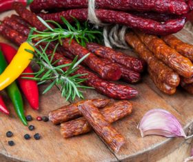 Sausages and peppers on the table Stock Photo