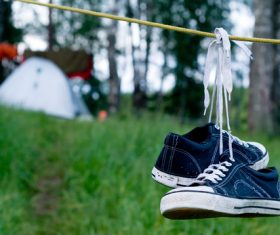 Shoes hanging on rope Stock Photo