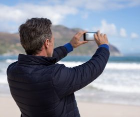 Shoot seascape with smart phone Stock Photo