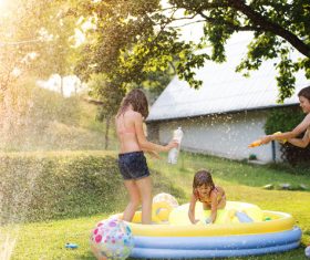 Sisters play in the water of summer Stock Photo 02
