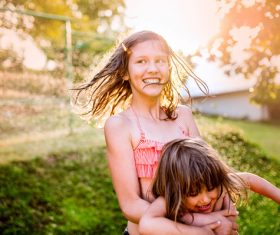 Sisters play in the water of summer Stock Photo 03