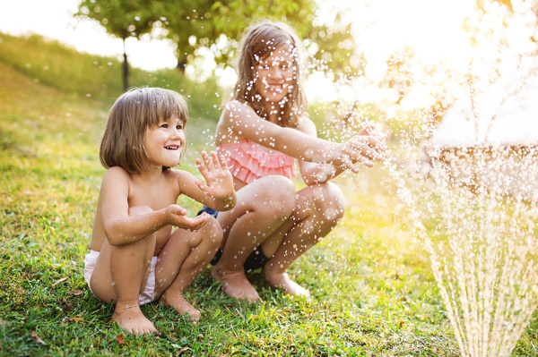 Sisters play in the water of summer Stock Photo 04