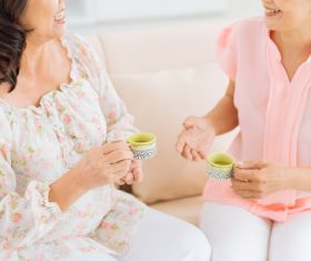 Woman drinking tea and chatting Stock Photo 01
