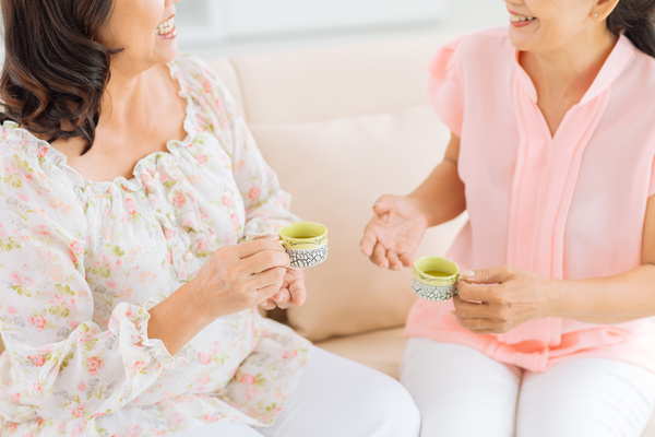 Woman drinking tea and chatting Stock Photo 01