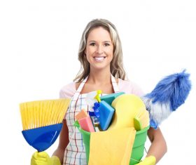 Woman holding cleaning supplies Stock Photo