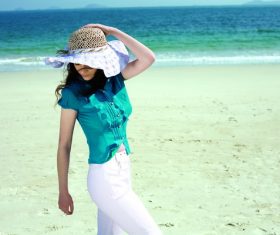 Woman posing by the sea Stock Photo