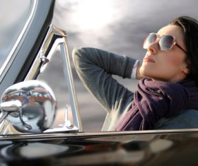 Woman sitting in convertible car Stock Photo