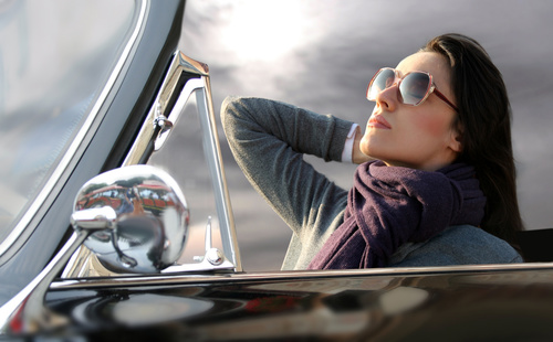 Woman sitting in convertible car Stock Photo