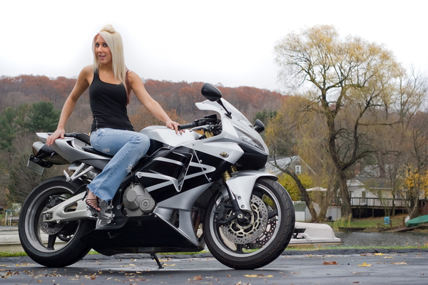 Woman sitting on motorcycle posing Stock Photo 01