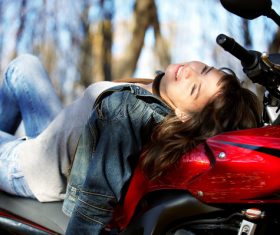 Woman sitting on motorcycle posing Stock Photo 03