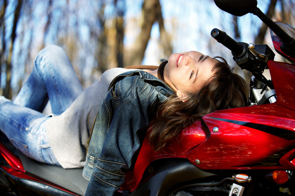 Woman sitting on motorcycle posing Stock Photo 03