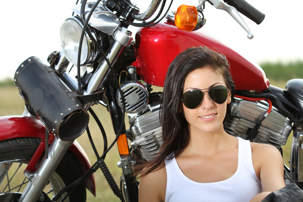 Woman sitting on motorcycle posing Stock Photo 07