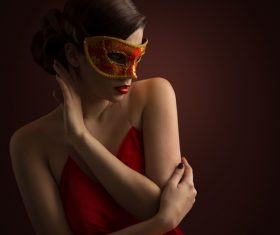 Woman wearing red mask Stock Photo