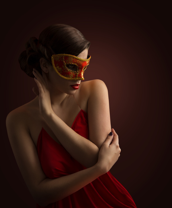 Woman wearing red mask Stock Photo