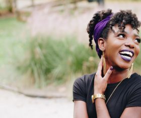 Young black woman posing with smiley Stock Photo