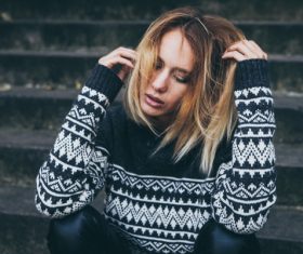 Young blonde girl in warm clothes Stock Photo