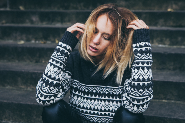 Young blonde girl in warm clothes Stock Photo