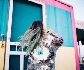 Young girl with stylish hairstyle and costume Stock Photo
