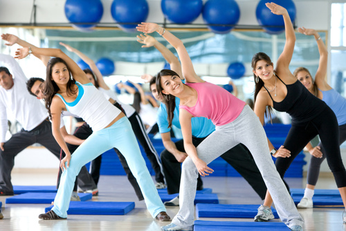 Young man doing vitality slimming exercises in the gym Stock Photo