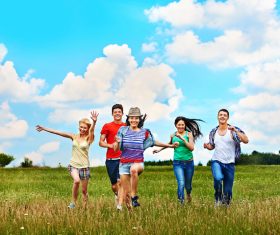 Young men and women running happily Stock Photo