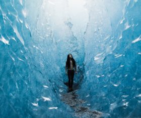 Young woman posing in frozen ice scene Stock Photo