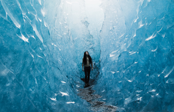 Young woman posing in frozen ice scene Stock Photo