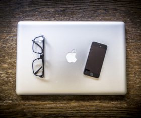 iPhone and Apple laptops on the desktop Stock Photo