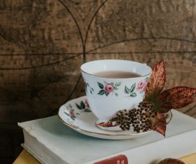 tea cup decoration on book Stock Photo