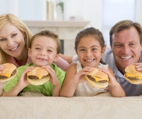 whole family likes to eat hamburgers Stock Photo