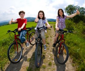 A family of three riding bicycle Stock Photo