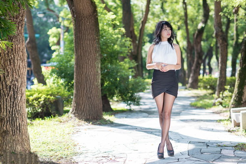 Asian girl posing in the park Stock Photo