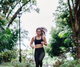 Asian girl running in the morning Stock Photo