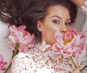 Beatutiful woman  lies among peonies Stock Photo (1)