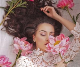 Beatutiful woman  lies among peonies Stock Photo (2)