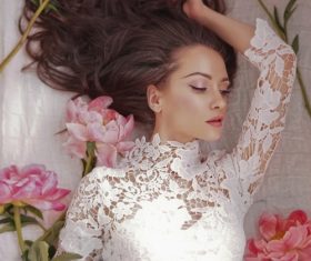 Beatutiful woman  lies among peonies Stock Photo (9)