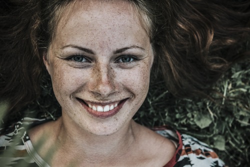 Beautiful woman with lots of freckles on face Stock Photo