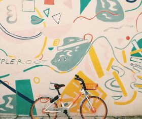 Bicycle near artistic painted wall Stock Photo