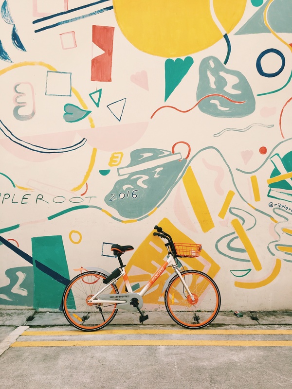 Bicycle near artistic painted wall Stock Photo