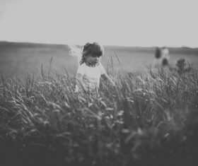 Black white picture of small girl playful outdoor Stock Photo